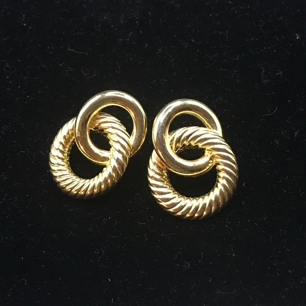 LCI gold tone pierced earrings.